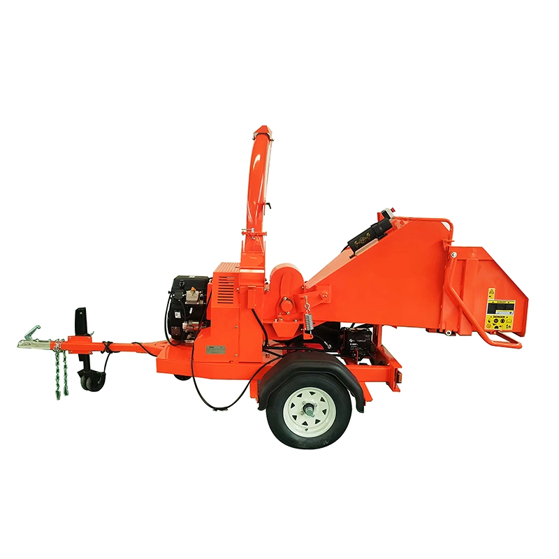 This trailer-mounted wood chipper is designed for efficient processing of branches and wood debris in landscaping, agricultural, and light forestry applications